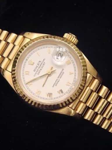 Ladies Rolex 18K Yellow Gold Datejust President White Roman 69178 (SKU 562DJMT)