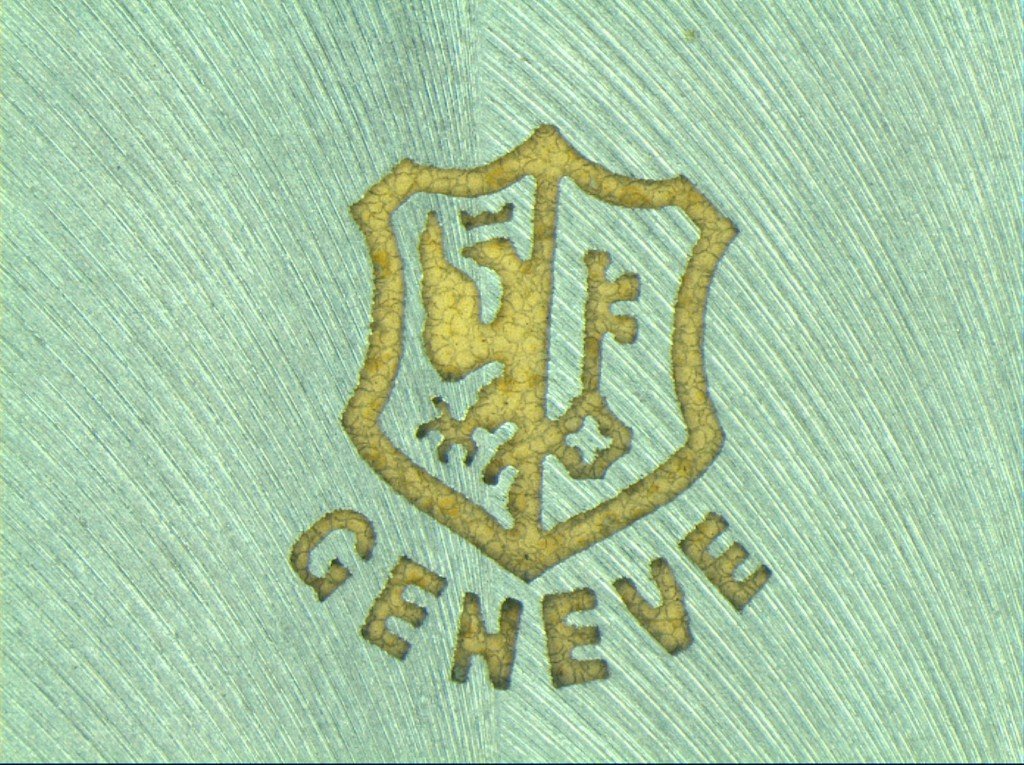 The New Nano Stamp, notice the metal crystals seen in the letters